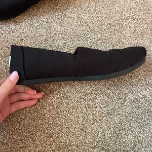 Never worn black Toms slip on shoes size 8